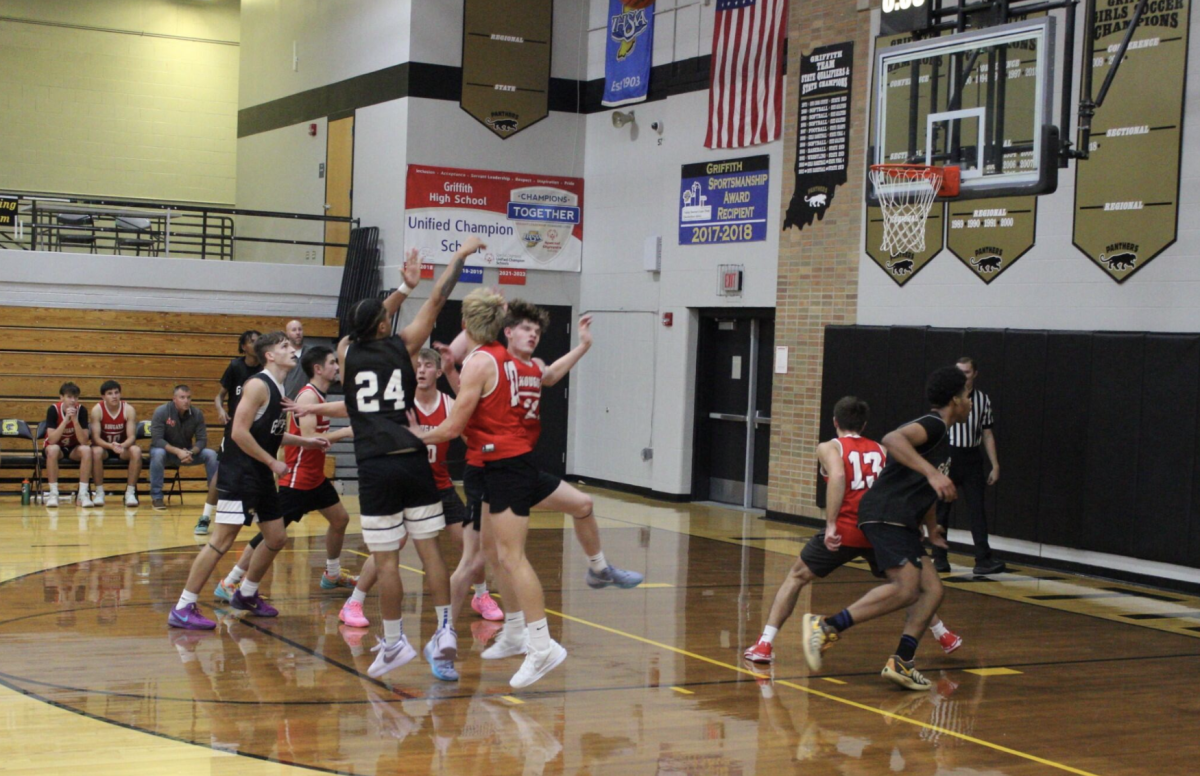 Gianni Feaster (24) takes a pull-up midrange during the second half of the scrimmage. 